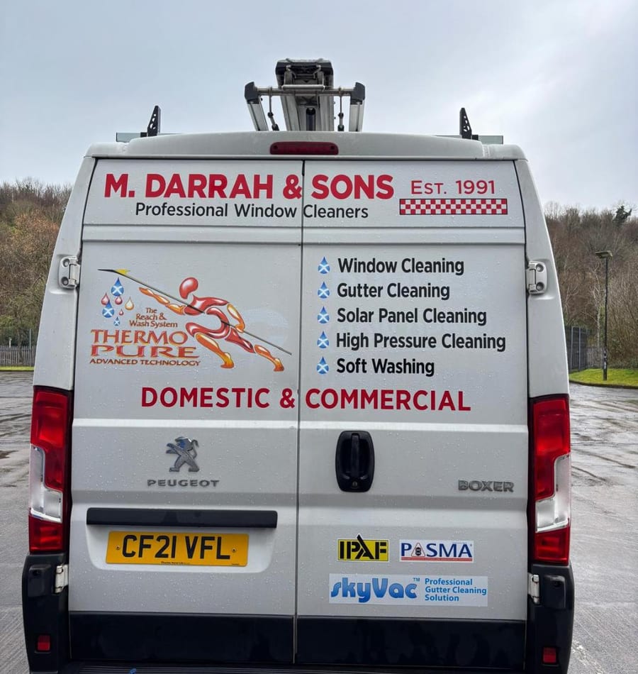 M Darrah & Sons van — rear, showing services and Est. 1991